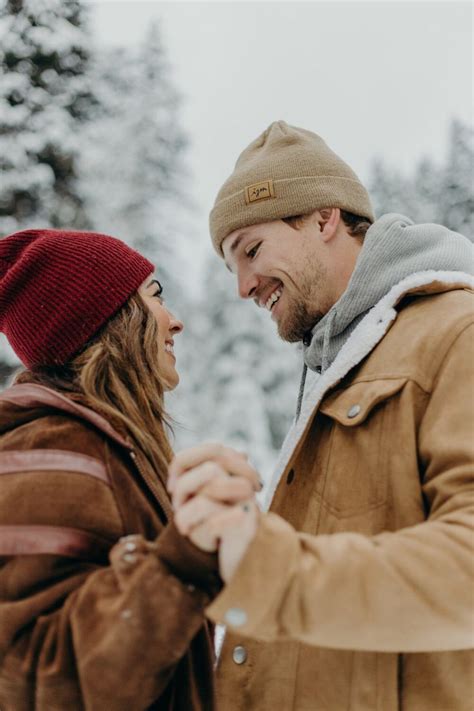 Snowy Winter Engagements Utah Mountains Wonderland Beanies Coats Couple