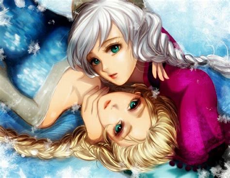 Two Women Laying On Top Of Each Other In The Snow With Their Arms