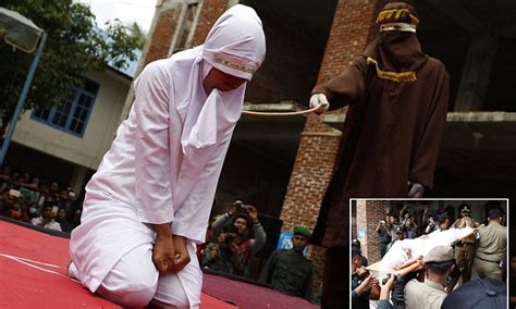Indonesian Woman Sobs As She Is Caned In Public For Having