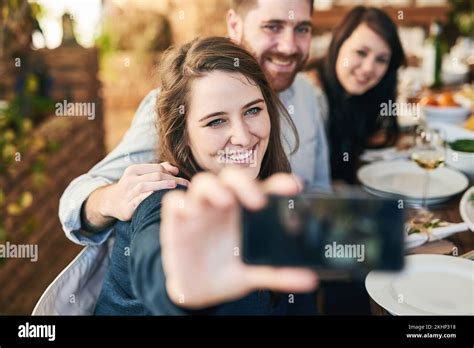 Friends Selfie And Dinner With Party And Celebration Woman Holding Smartphone For Photo And