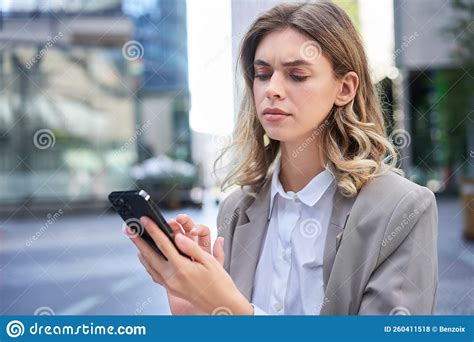 Young Businesswoman Looking Complicated Frowning As Reading Message On