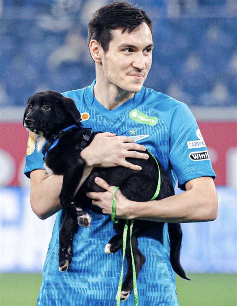 Professional Soccer Players Onto The Field With Shelter Dogs In Need Of