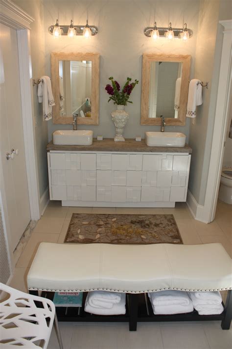 This bench is removeable when not in use. This bathroom renovation includes a HomeGoods bench ...