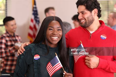 Mixed Race Couple Is All Smiles As They Vote In Usa Election High Res