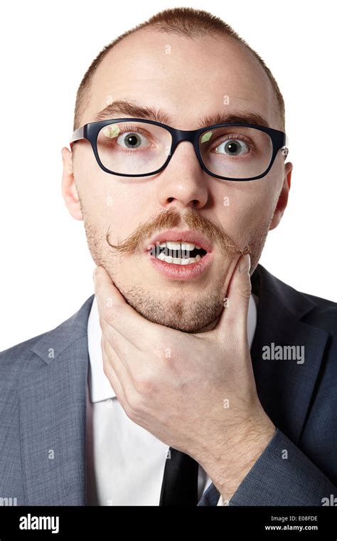 Studio Shot Of Young Man Holding His Chin Facial Expression Stock