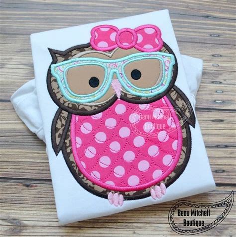 An Applique Owl With Glasses On Its Face