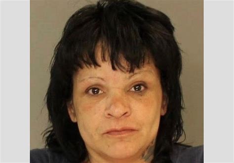 Woman 48 Charged With Robbing Convenience Store At Gunpoint