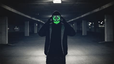 Man Wearing A Glowing Mask Hd Wallpaper 1600x900 Hd Wallpaper