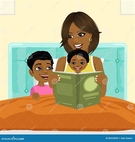African American Mother Reading A Book To Son And Daughter In Bed Before Going To Sleep Stock