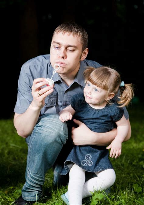 Father And Daughter Blowing Soap Bubbles Stock Image Colourbox