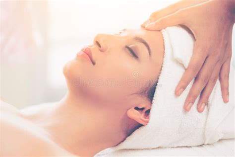 Relaxed Woman Gets Facial And Head Massage In Spa Stock Image Image