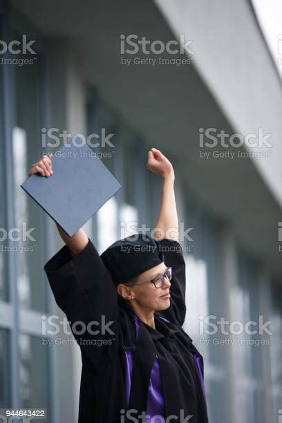 Pretty Young Woman Celebrating Joyfully Her Graduation Stock Photo