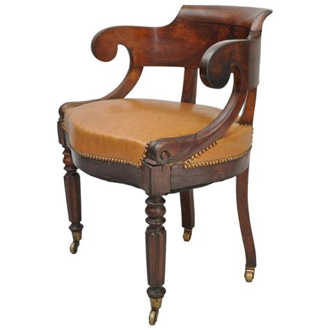 If the fireside armchair chat involves spirited comparisons, your companions will likely probe the merits of antique and vintage armchairs. Antique English Empire Regency Mahogany Curved Caramel ...