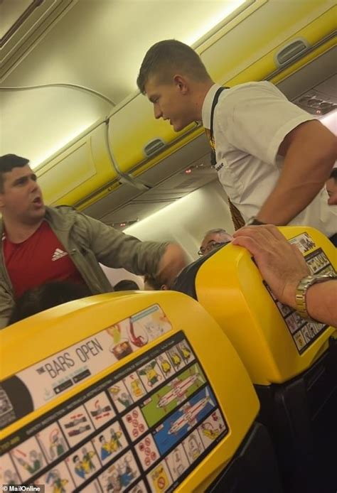 Exclusive Terrifying Moment Drunk Ryanair Passenger Struggles With Cabin Crew After Buying A
