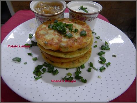 Mashed potato keeps these potato pancakes soft in the middle, but crisp on the outside. Potato Latkes - Jewish Pancakes #BreadBakers - Sneha's Recipe