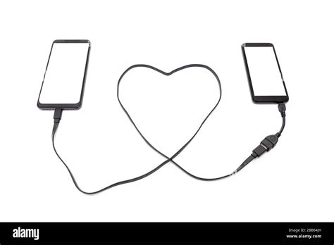 Hand Connecting Two Smartphones With A Heart Shaped Usb Cable Long