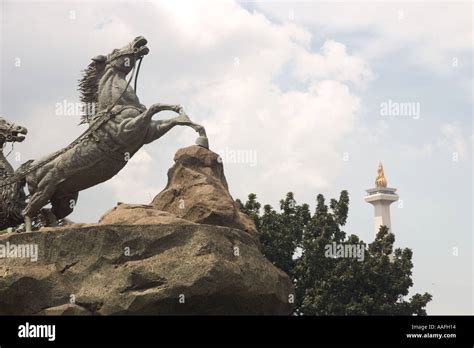 Arjuna And Krishna Statue Jakarta With The National Monument Monas In