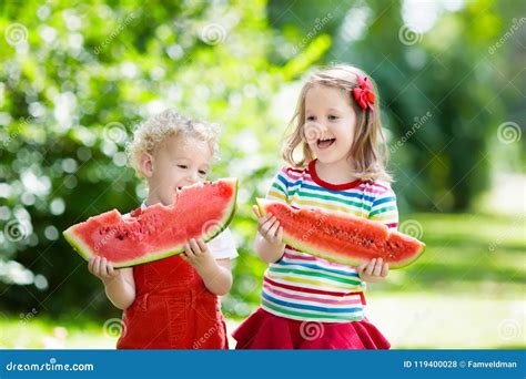 Kids Eating Watermelon In The Garden Stock Photo Image Of Kids Mouth