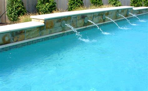 Learn 5 ideas to help you clean up your poolscape to get ready for the pool season. Water Features For Pools, Swimming Pool Wall Water ...