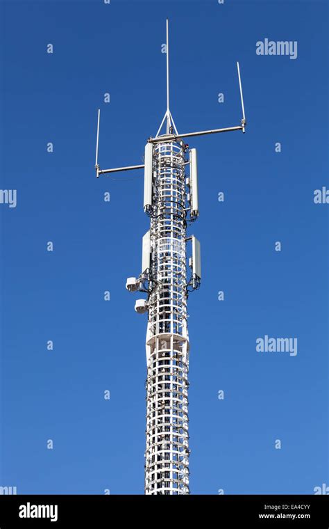Communication Tower With Gsm And Radio Devices Above Blue Sky Stock