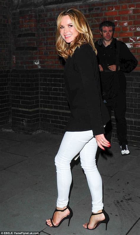 Amanda Holden Showcases Her Slender Legs In Tight White Jeans As She