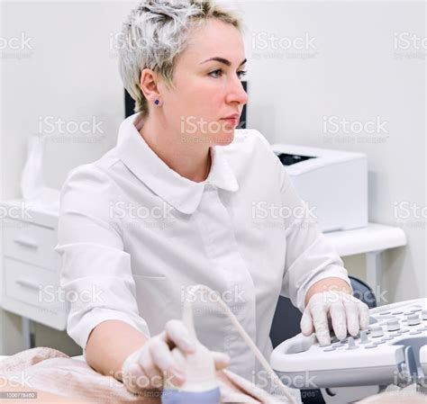 Gynecologist Doing Ultrasound Scan In Modern Clinic Stock Photo