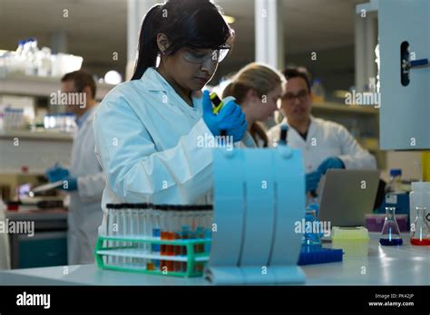 Female Scientist Using Pipette In Laboratory Stock Photo Alamy