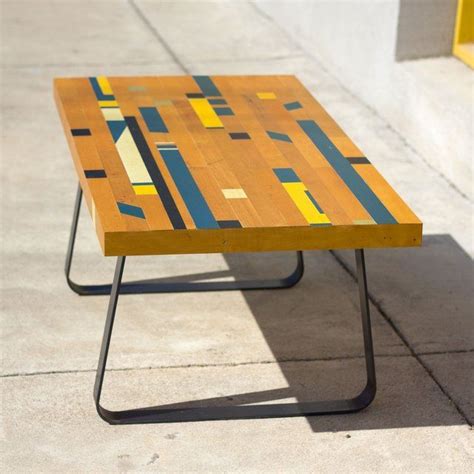 This basketball hoop shaped coffee table features a large silk screened team logo and real all white basketball net. Reclaimed Gym Floor Coffee Table | Gym flooring, Flooring