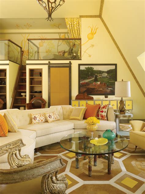A very refined living room with yellow walls, a stucco ceiling, a gallery wall, a crystal chandelier and chic furniture. 28 Yellow Living Room Decorating Ideas - Decoration Love