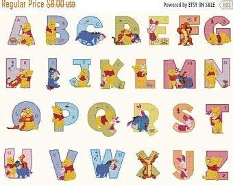 Cross stitching cross stitch embroidery cross stitch patterns iris cross stitch flowers hobbies and crafts needlework alphabet projects to try. Alphabet Disney characters Cross Stitch Alphabet Disney ...