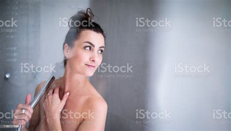 Pretty Young Woman Taking A Long Hot Shower Washing Her Hair Stock