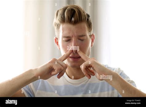 Hand Pinching Nose High Resolution Stock Photography And Images Alamy