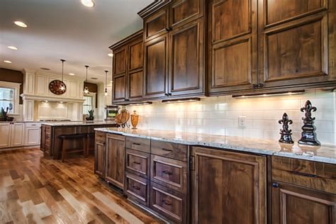 Some prefer the predictability of engineered materials like thermofoil and laminate but if you want a natural look, nothing compares to the beautiful color variations to many type of wood are using in the kitchen cabinets. What type of wood are these beautiful stained cabinets ...