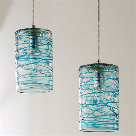 This beautiful swirling glass pendant with the added sculptural glass accentuating the swirl pattern on the outside is a unique, exciting take on a classic art glass pendant. Swirling Glass Cylinder Pendant - Shades of Light