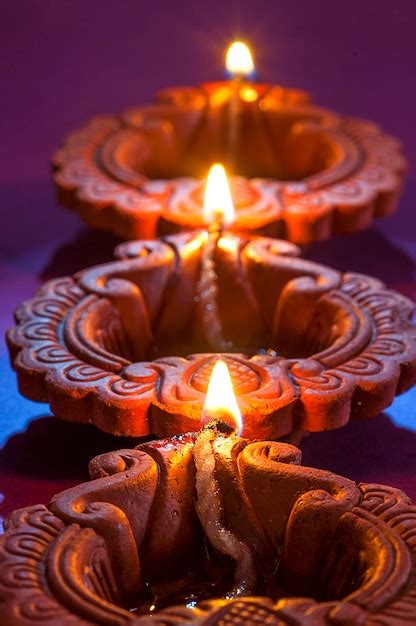 Premium Photo Clay Diya Lamps Lit During Diwali Celebration