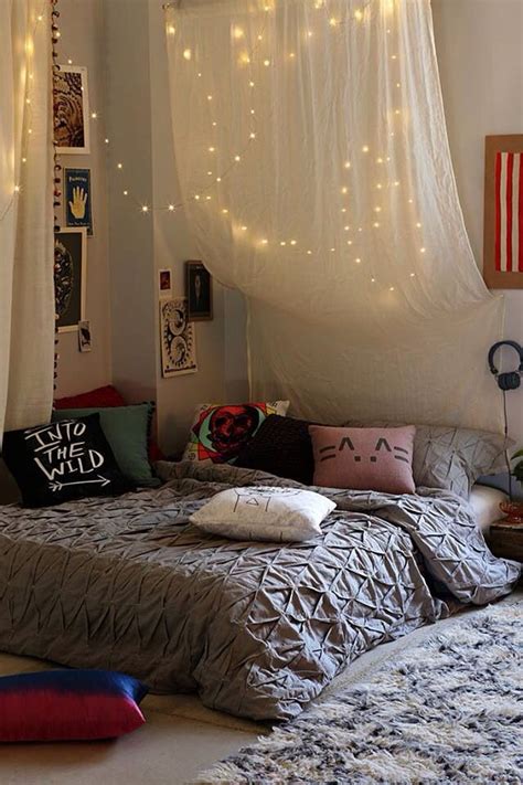 Canopy attached to the ceilings with lights. How You Can Use String Lights To Make Your Bedroom Look Dreamy