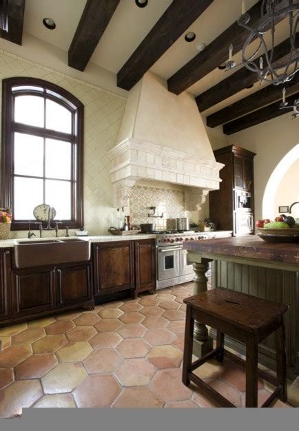 Antique terracotta saltillo tile really adds to the appeal of this. Jauregui - Mediterranean - Kitchen - Austin - by Clay Imports