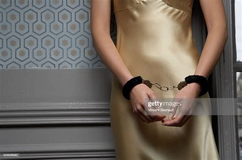 Woman Wearing Handcuffs Photo Getty Images
