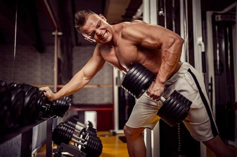 Premium Photo Strong Bodybuilder Doing Heavy Weight Exercise For Back