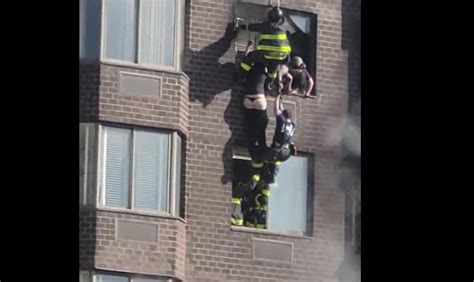 Watch Firemen Save Woman Dangling From Window On Th Floor After Massive Fire Erupts In