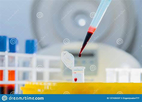 Dna Test In The Lab Dispenser With Blood And Test Tubes Close Up Stock