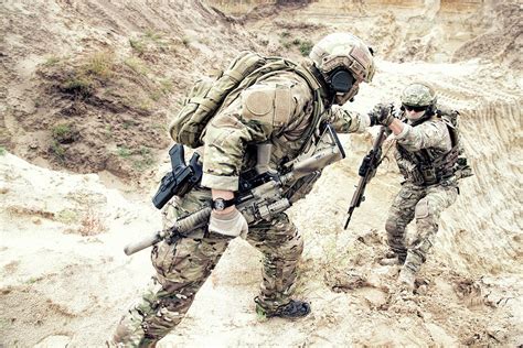 Us Soldier Helping A Fellow Soldier Photograph By Oleg Zabielin Pixels