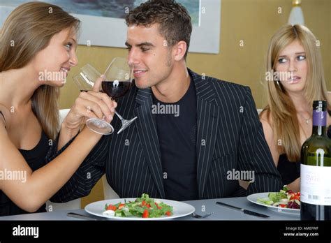 Young Couple Drinking Red Vine Blond Woman Watching Envious Stock