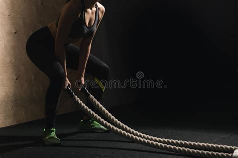 Battling Ropes Girl At Gym Workout Exercise Fitted Body Stock Photo