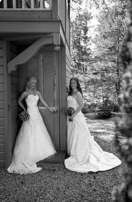 Two Brides Standing In Front Of A House
