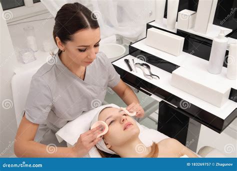 Facial Treatment Of Young Woman In A Cosmetology Salon Stock Image