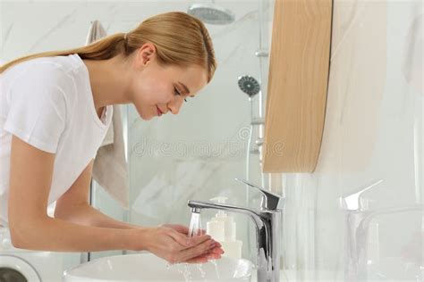 Happy Young Woman Washing Hands In Bathroom Stock Image Image Of