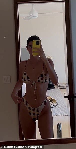 kendall jenner drops jaws as she playfully pulls down bikini bottoms while showcasing her