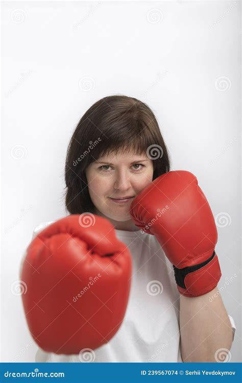 Portrait Of Confident Young Woman In Boxing Gloves Woman Fights For