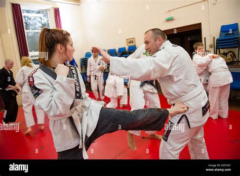 A Woman Girl Fighting A Man Training In Self Defence At A Royce Gracie